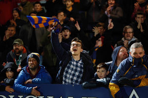 Supporters celebrate the win