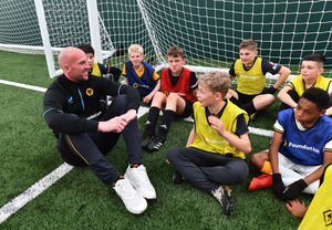 Goalkeeper John Ruddy sits down with the youngsters. Photo: Dave Bagnall