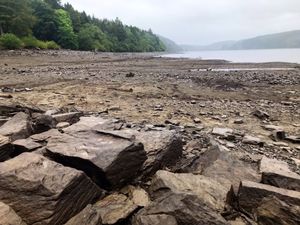 Supporting image for story: Rarely-seen dam wall exposed as reservoir level drops significantly