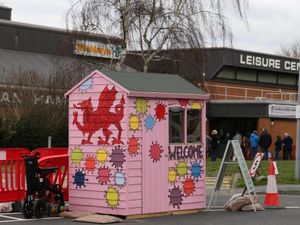 Supporting image for story: In the pink: Splash of colour helps put vaccine visitors at ease 