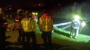 Crews work to remove the car from the canal, picture: Huw Jones