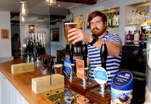 Lee Quester behind the bar at the Boathouse in Shrewsbury