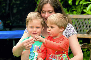 Sarah looks at the fragments with her sons Benjamin and Harry