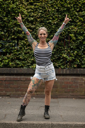 Music fan Tanya Baker, from the USA, arrives to attend British rock band Black Sabbath's "Back to The Beginning" concert, Ozzy Osbourne's final ever gig as Black Sabbath's frontman at Villa Park in Birmingham, central England on July 5, 2025. Osbourne, who revealed in 2020 that he has Parkinson's disease, will join Tony Iommi, Geezer Butler and Bill Ward for the all-day "Back To The Beginning" show in Birmingham, central England, where the heavy metal giants formed in 1968. (Photo by Oli SCARFF / AFP) (Photo by OLI SCARFF/AFP via Getty Images)          