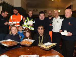 Supporting image for story: Emergency workers battling Ironbridge floods treated to curry