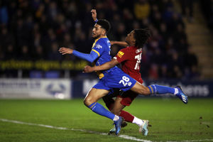 Yasser Larouci fouled Town's Josh Laurent for the penalty
