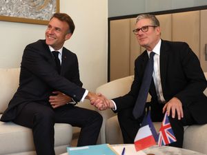 Sir Keir Starmer and Emmanuel Macron shaking hands