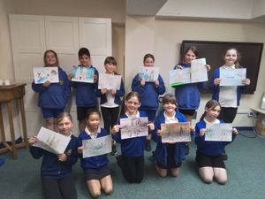 Pupils from St Joseph and St Theresa’s Catholic Primary School in Burntwood are pictured with their artwork.
