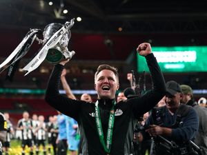 Newcastle head coach Eddie Howe celebrates with the trophy following victory over Liverpool in the Carabao Cup final