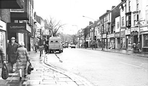 High Street, Brierley Hill. This photograph includes the premises of the library, Midland Bank, Don Foyle, Sketchley, Supasnaps, Dewhurst, Sun Valley and Staffordshire Building Society.