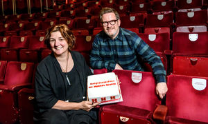 Matthew Bourne with his seat plaque at Birmingham Hippodrome