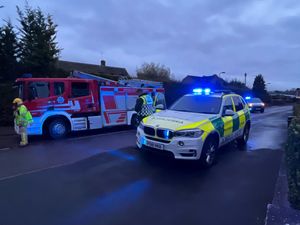 Supporting image for story: Motorcyclist lying injured in road helped by passers-by before being airlifted to hospital