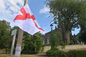 DUDLEY COPYRIGHT NATIONAL WORLD STEVE LEATH 21/08/25  A flag close to one of the main churches in Sedgley.  