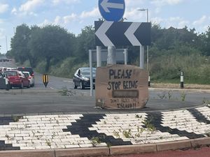 Supporting image for story: Huge sign put on roundabout by resident sends strong message to drivers 'blocking island'