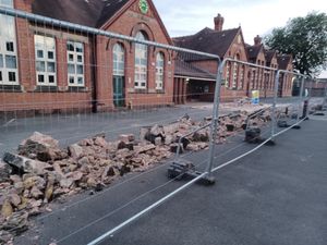 After: the wall now lies in ruins