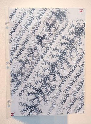 Part of the exhibition features over 1000 pieces of laminated paper stuck to the walls with different rubber stamp artwork on them