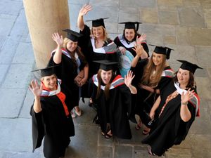 Delighted students celebrate outside the church