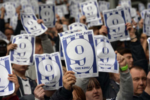 West Bromwich Albion Fans hold up Justice for Jeff Astle posters up on nine minutes played
