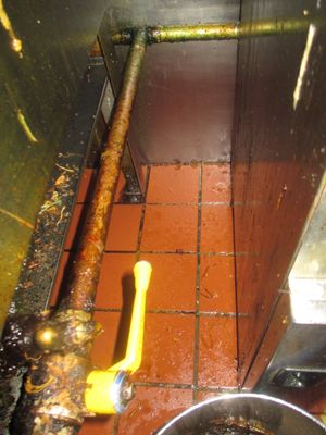 Grease and food debris around the cooking range