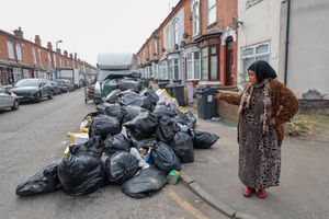 Hawida Osman local resident standing next to rubbish on Percy Road in Sparkhill Birmingham  ahead of Tuesday's 'all out strike'.  