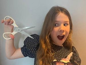 Supporting image for story: 'Caring, thoughtful, and with just the right amount of crazy' – nine-year-old Evelyn ready to chop her locks for charity
