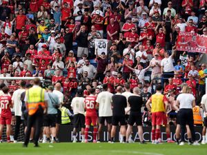 Liverpool fans pay tribute to Diogo Jota as the players watch on following the pre-season friendly at Preston