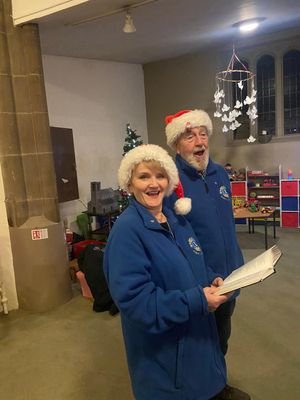 Lions Elaine and John singing along to the carols