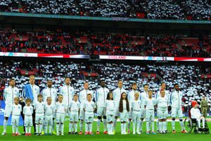 Lloyd Burton, right, from Shrewsbury, with the England team at Wembley Stadium