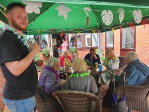 Supporting image for story: Care home residents and local community get together for BBQ and entertainment