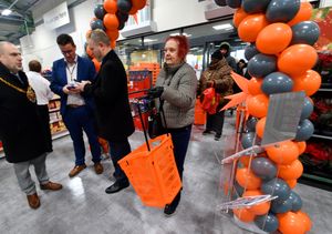 The first shoppers make their way into the store.