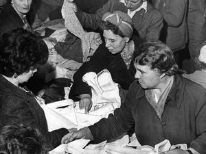 PICTURE FROM THE ARCHIVE: A picture of a frantic search for bargains from May 25, 1962. The caption read: ‘The rush is on, and there are bargains galore at the Codsall Roman Catholic Church jumble sale held at the Crown Hotel, Codsall. The proceeds were for church funds.' The image was taken by Johnnie Johnson. 