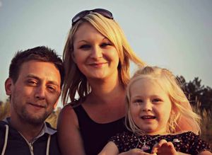 Kelli Smith, six, suffers from neuroblastoma, with her parents