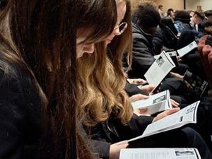 Wolgarston Students pictured reading along as performances took place on stage