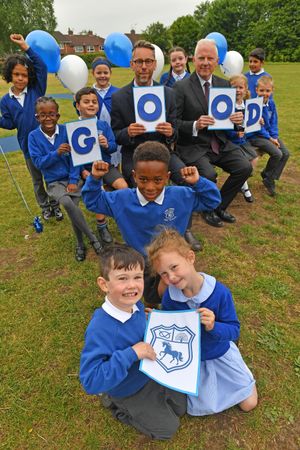 ane Green First School has received a good ofsted. after previously being told it needed to improve. It is part of the South Staffordshire Learning Partnership. Pictured with students are left, Tom Wright and Alun Harding.