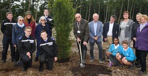 L to R: 'Terry Wood planting the Yew Tree with Sutton Coldfield Charitable Trust Chair of Trustees, Chief Executive, almshouse residents, Little Sutton Primary School children, West Midlands Police Cadets at Manorial Wood for the Queen’s Jubilee Canopy Initiative in Sutton Coldfield.' 
