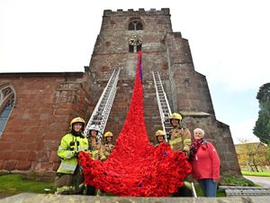 Supporting image for story: 'Beautiful and stunning' poppy display is hung from church near Shrewsbury for Remembrance, with a little help from the fire brigade