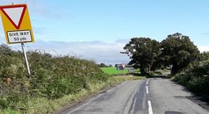A before picture shows how the give way lines were hidden and how the road appeared to continue straight on 