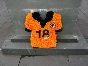 Supporting image for story: Flowers in the shape of tragic Diogo Jota's shirt amongst the tributes at Wolves pre-season friendly