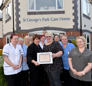 Susan Holdway, business and hospitality manager at the care home, left, and Cheryl Walne with the award