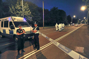 Officers block the way as forensics head towards the mosque