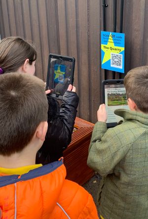 Trinity School pupils scanning the Quarry QR ode to download relevant historical and cultural facts