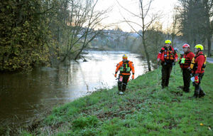 Members of West Midlands Search and Rescue searching the banks of the River Severn alongside Sydney Avenue in Shrewsbury