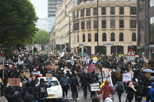 People marching down Colmore Row during a Black Lives Matter protest rally