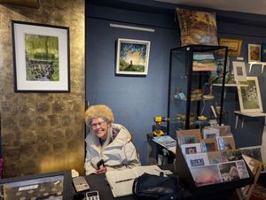 Rose Roberts, all smiles behind the counter at Shrewsbury Arts and Crafts, the shop run at Perches House by her daughter, Jessica Richards
