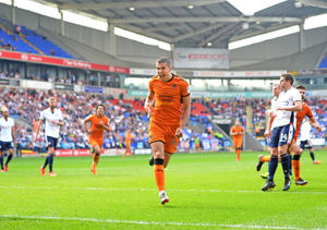 Conor Coady celebrates scoring his penalty that put Wolves 3-0 up