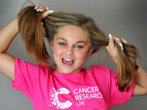 Supporting image for story: Schoolgirl in headshave for children's wig charity