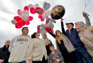 Balloons are released into the sky at Dell Stadium