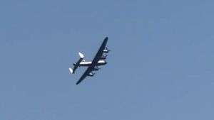 Lancaster Bomber flies over Baxterley, North Warwickshire.