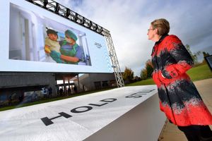 MD of the Arboretum Philippa Rawlinson looks at one of the photos 