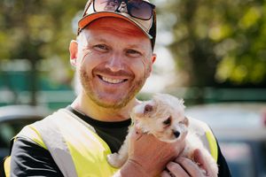 Lee Rogers holding a puppy